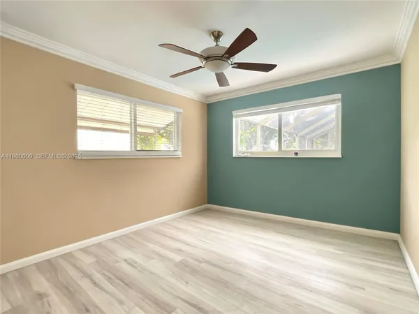 a view of an empty room with a window