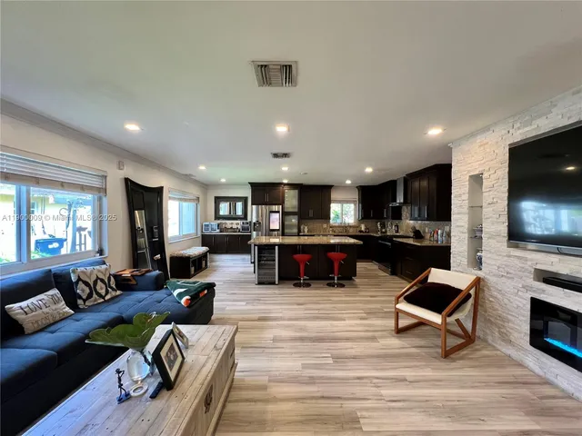 a living room with furniture and a lamp