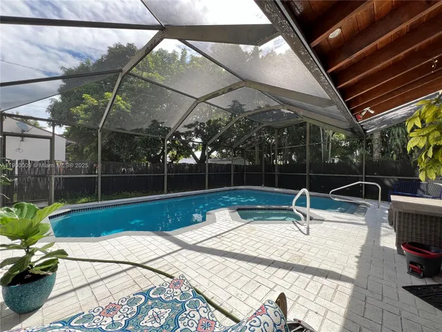 a view of swimming pool with outdoor seating