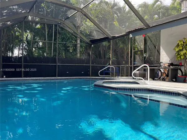 a view of swimming pool with outdoor seating