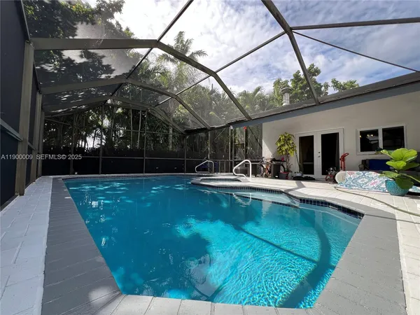 a view of swimming pool with a patio