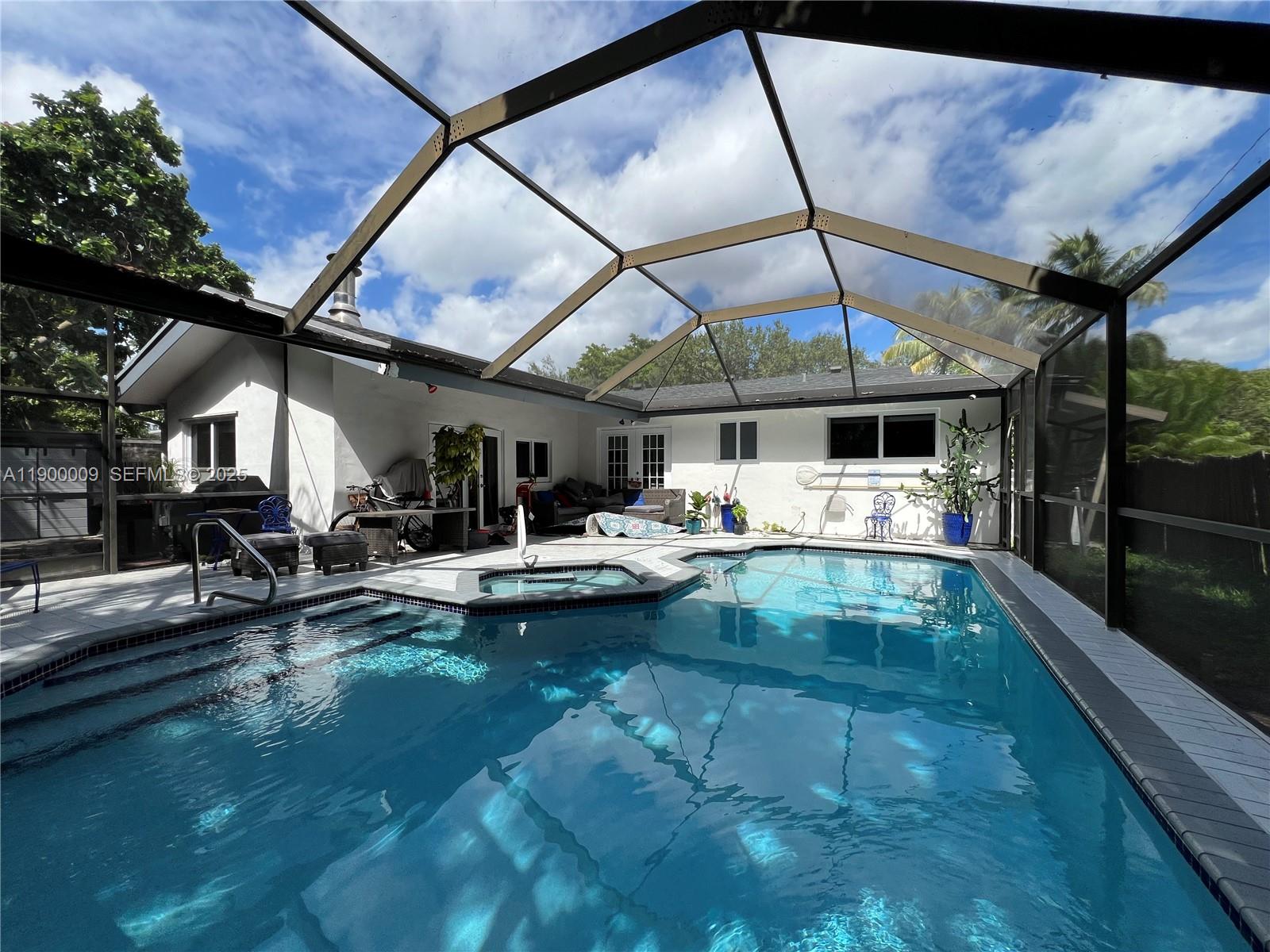 10220 Southwest 160th Street, Unit 10220 Miami, FL 33157 - Photo 50 of 57 a view of swimming pool with outdoor seating