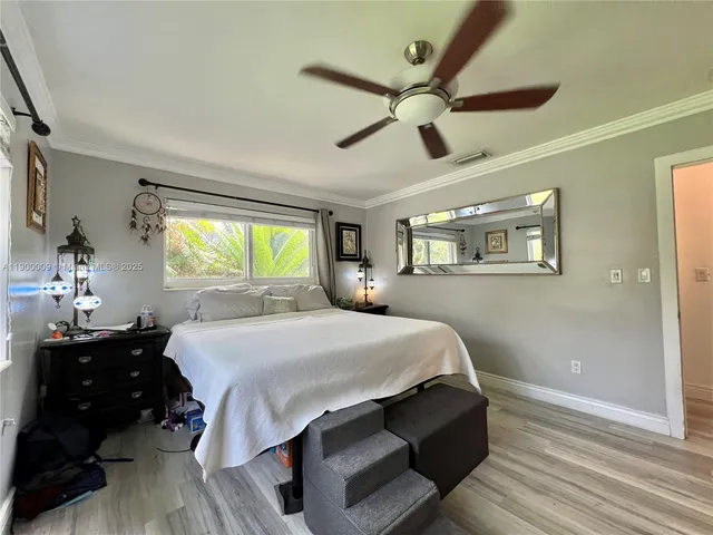 a bathroom with a granite countertop sink a toilet and a mirror