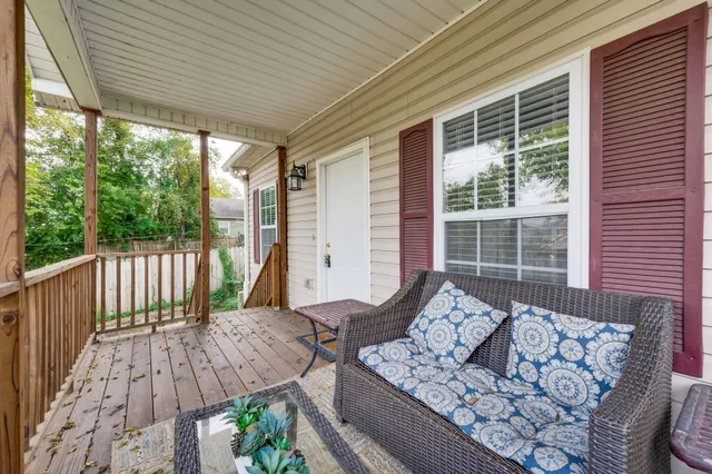 a view of balcony with furniture