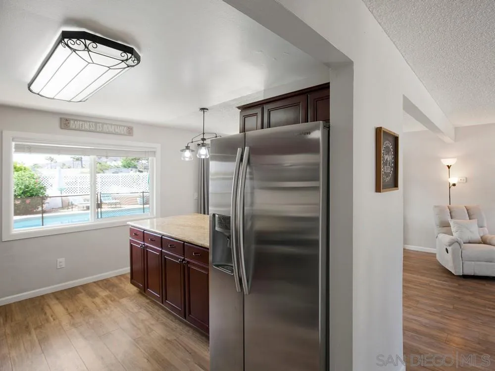 13730 Somerset Road Poway, CA 92064 - Photo 13 of 24 a kitchen with stainless steel appliances granite countertop a refrigerator and a sink
