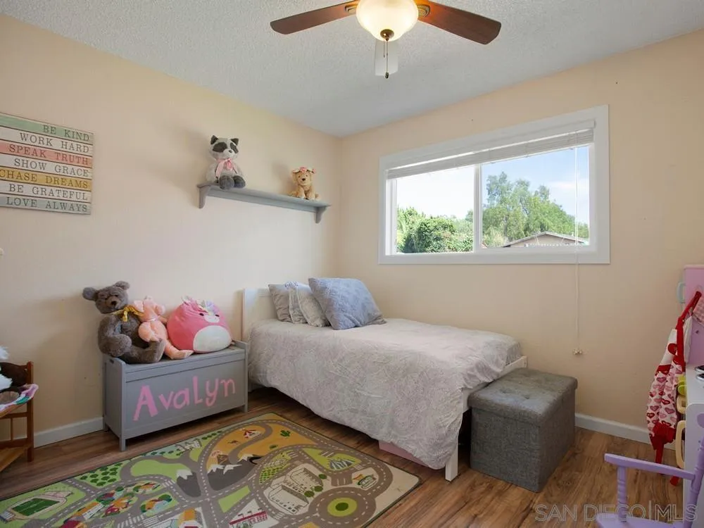 13730 Somerset Road Poway, CA 92064 - Photo 19 of 24 a bedroom with bed and window