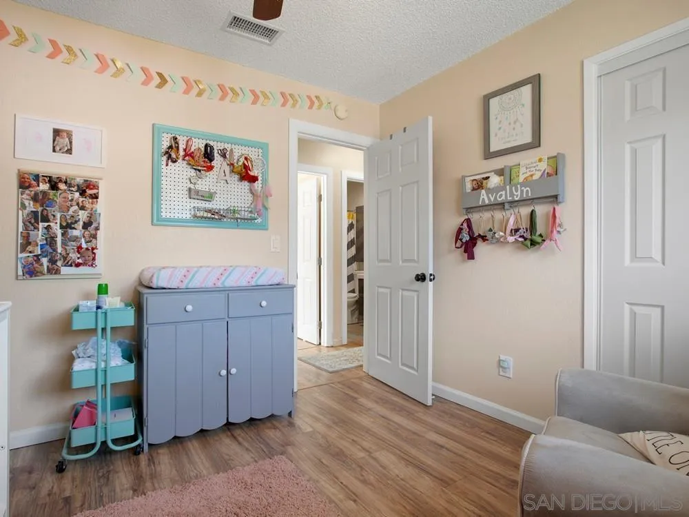 13730 Somerset Road Poway, CA 92064 - Photo 21 of 24 a living room with furniture and wooden floor