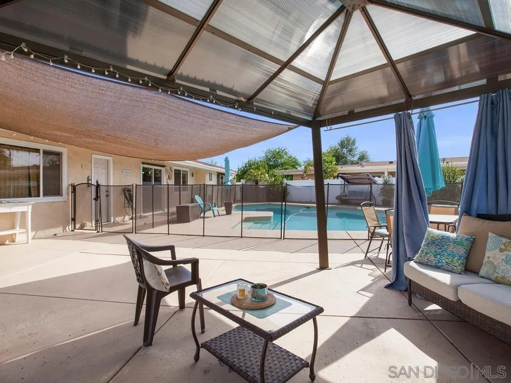 13730 Somerset Road Poway, CA 92064 - Photo 5 of 24 a outdoor living space with patio furniture and a potted plant