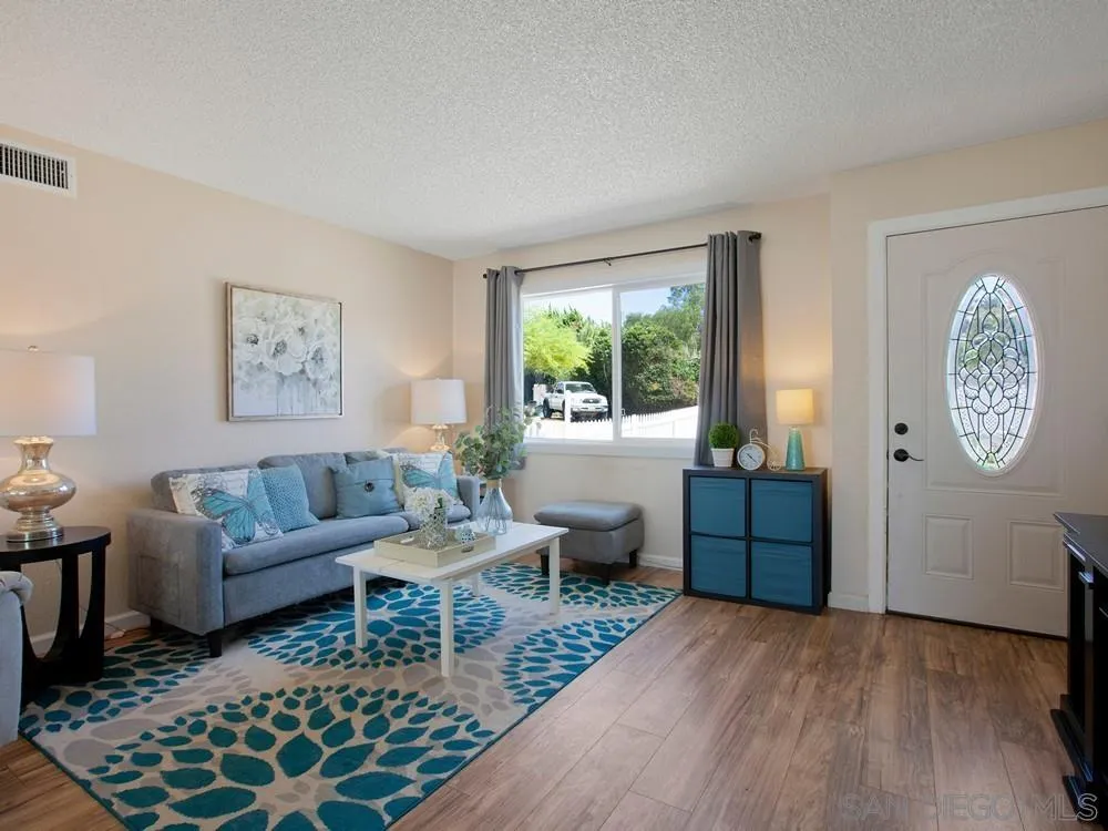 13730 Somerset Road Poway, CA 92064 - Photo 8 of 24 a living room with furniture a rug a window and a table