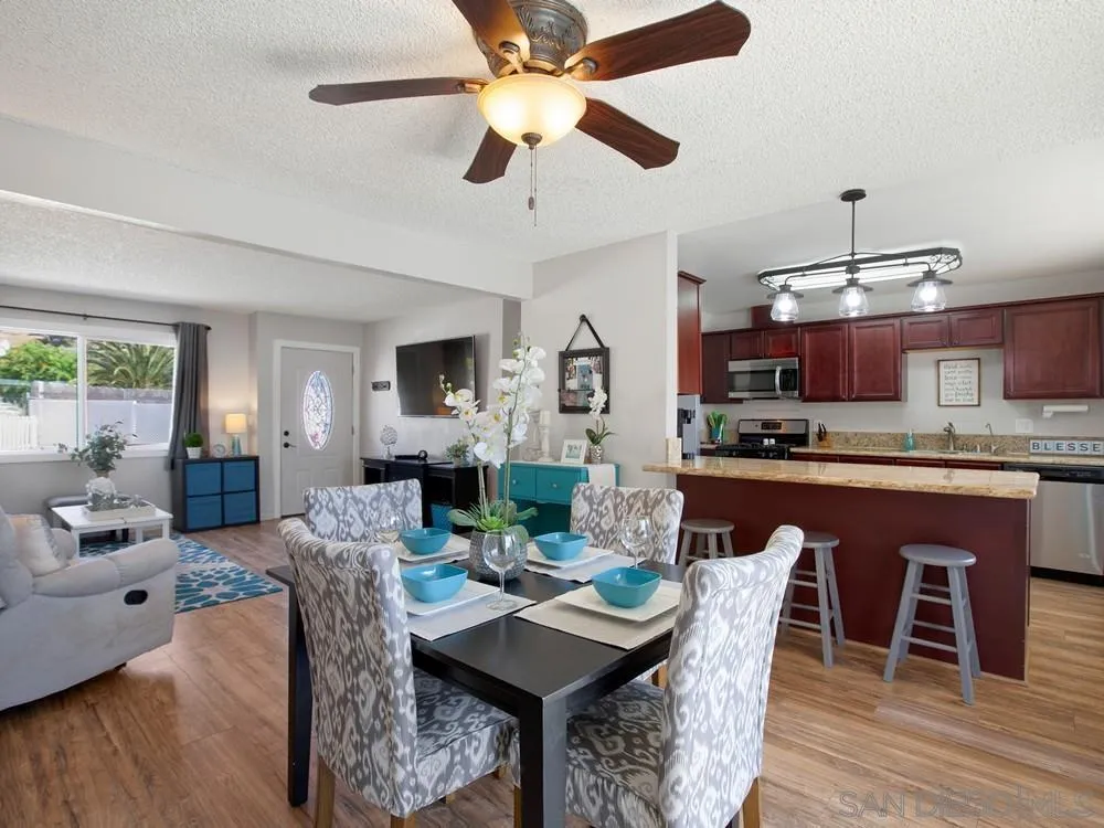 13730 Somerset Road Poway, CA 92064 - Photo 10 of 24 a view of a dining room with furniture window and wooden floor