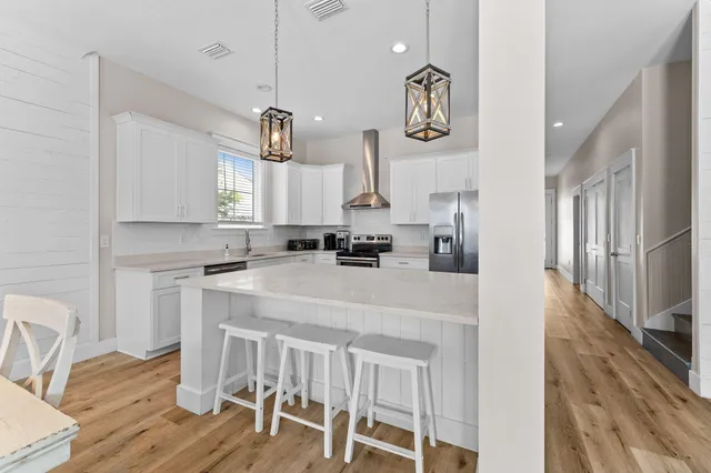 a building outdoor space with patio furniture and potted plants