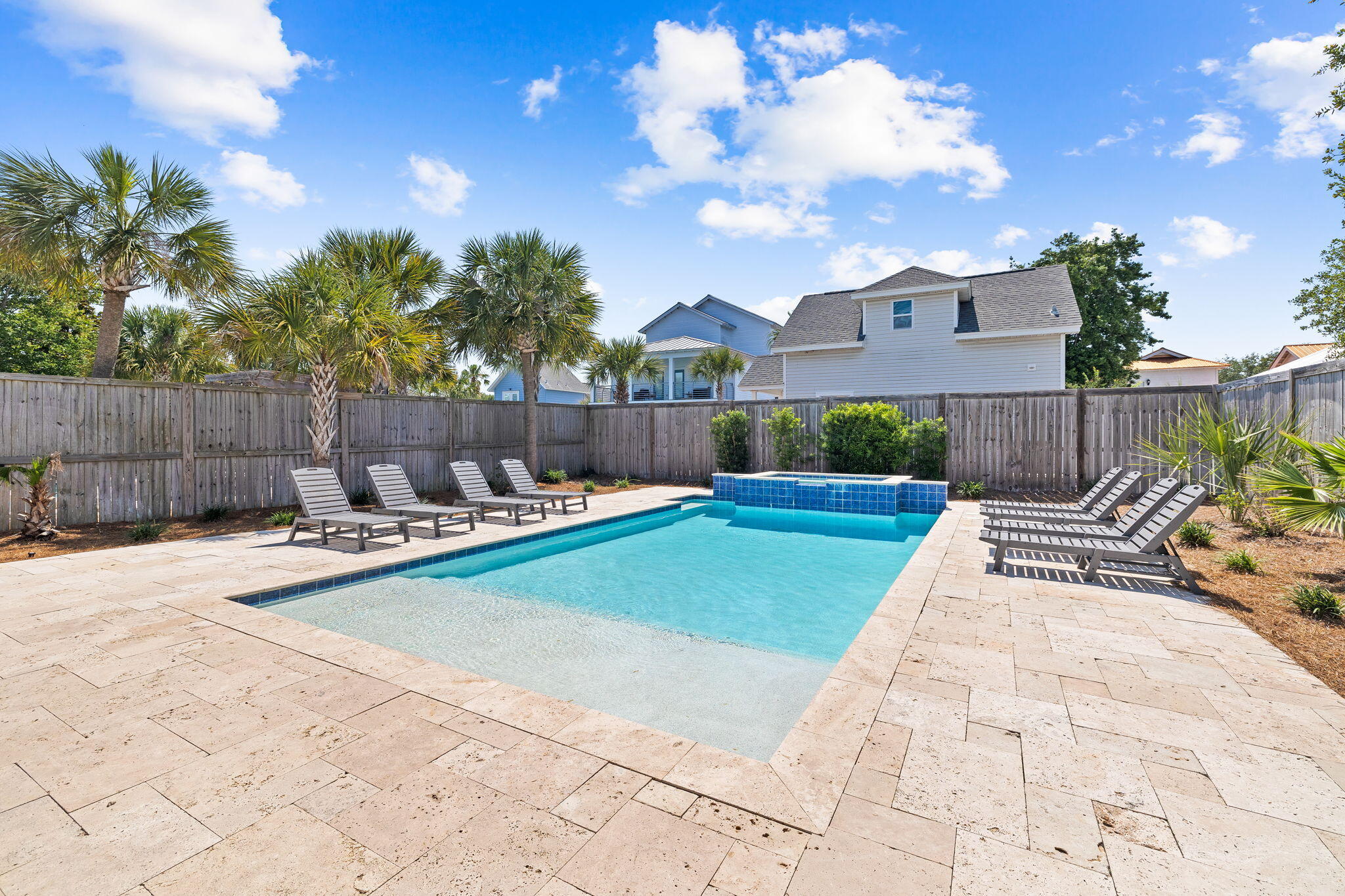 106 Shirah Street Destin, FL 32541 - Photo 27 of 91 a view of a backyard with a fountain plants and large tree
