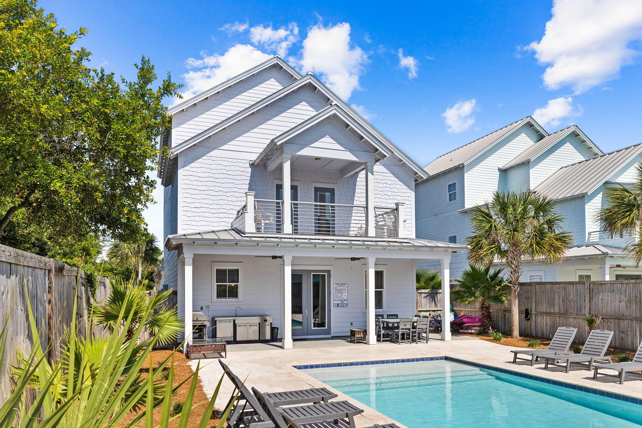 106 Shirah Street Destin, FL 32541 - Photo 29 of 91 a view of a house with swimming pool and furniture
