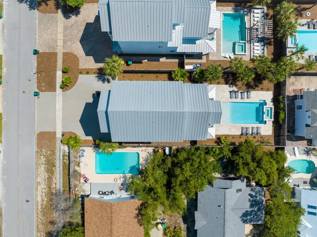 a living room with furniture and a view of kitchen