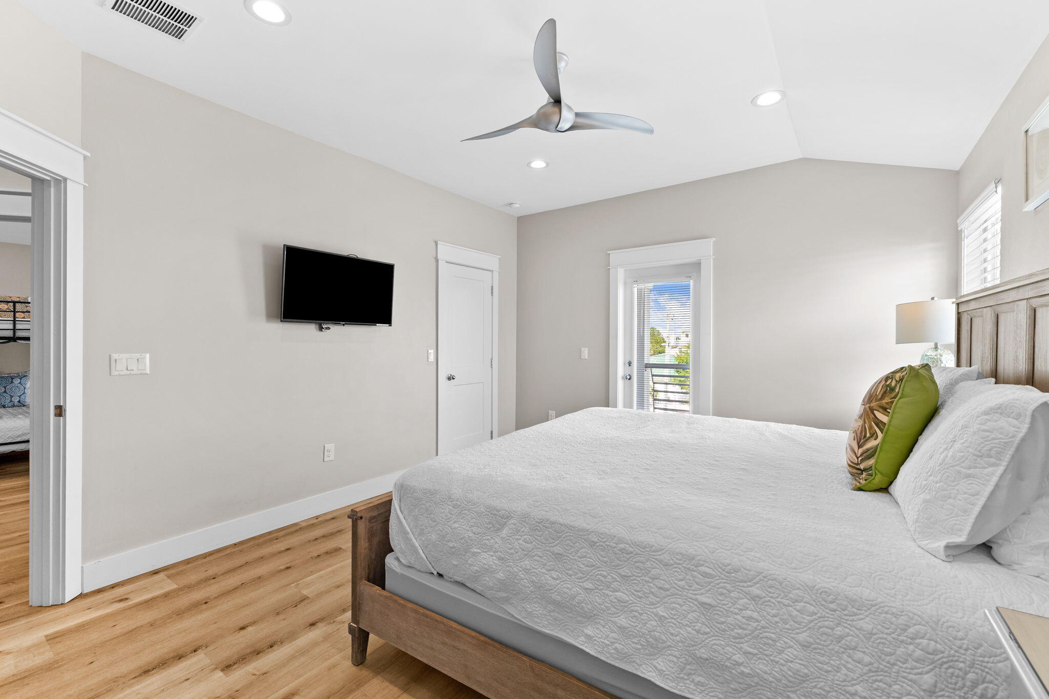 106 Shirah Street Destin, FL 32541 - Photo 38 of 91 a bedroom with a bed and a flat screen tv