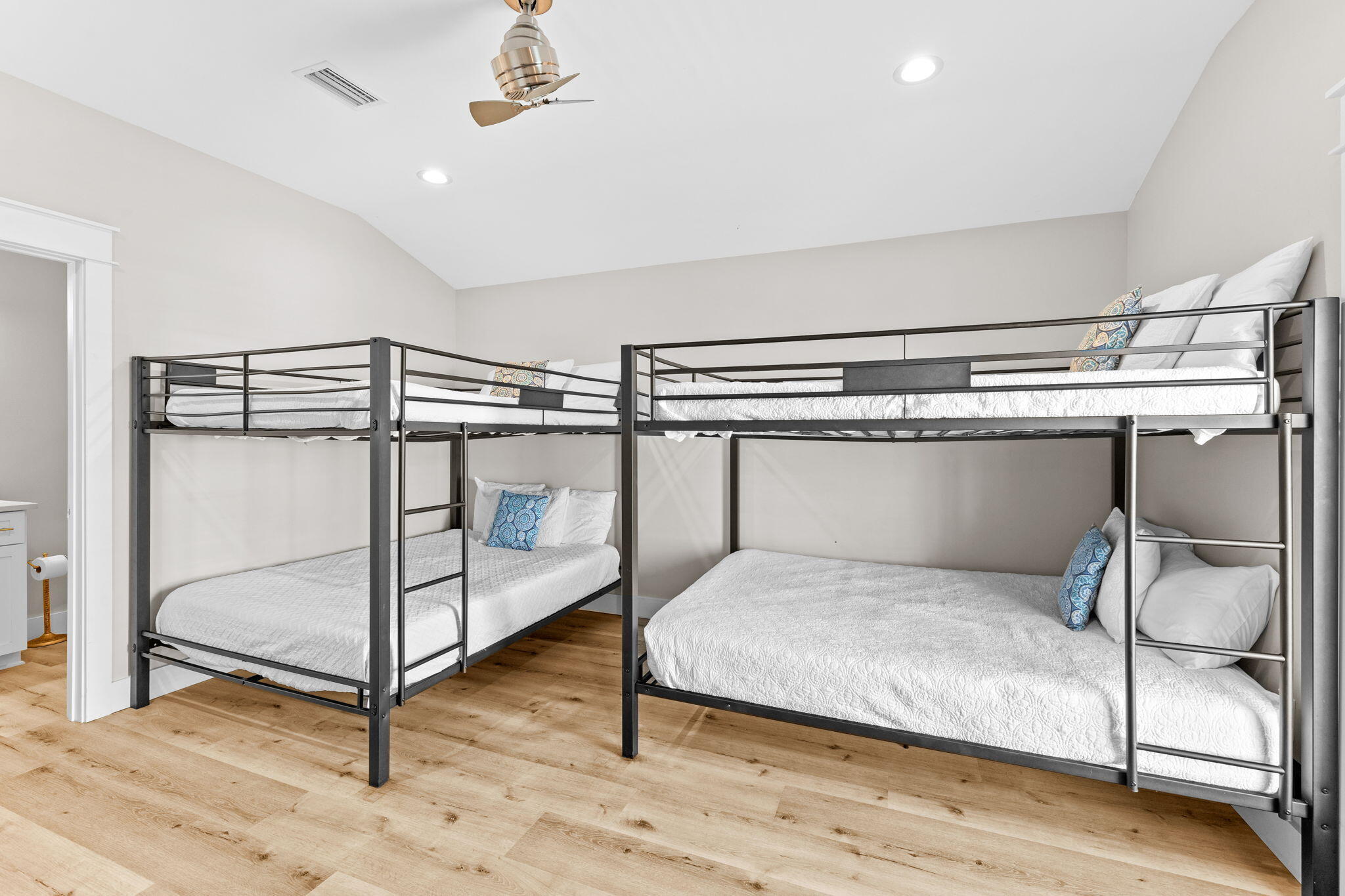 106 Shirah Street Destin, FL 32541 - Photo 60 of 91 a bedroom with a bed and a wooden floor