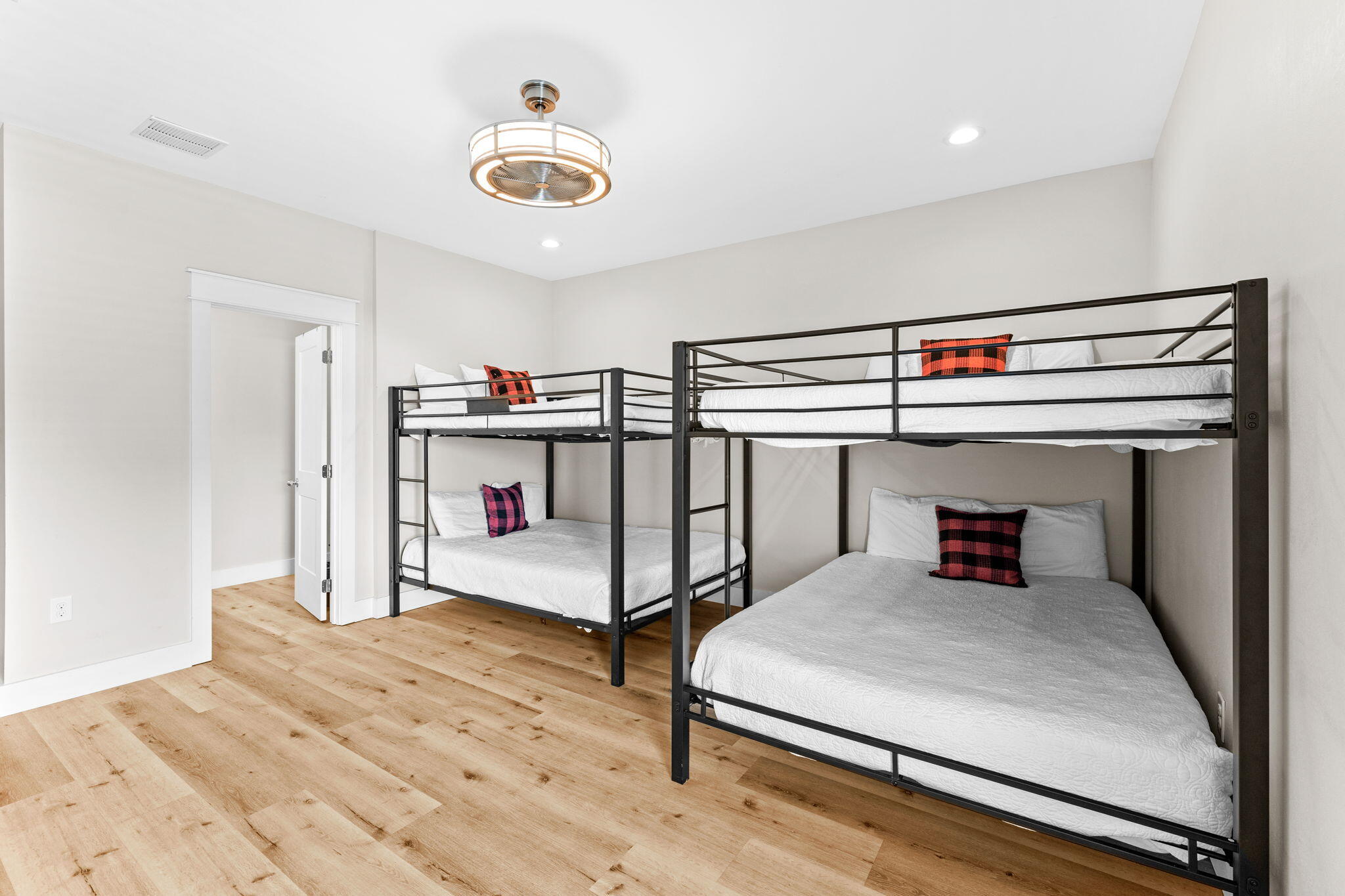 106 Shirah Street Destin, FL 32541 - Photo 65 of 91 a bedroom with a bed and a chandelier