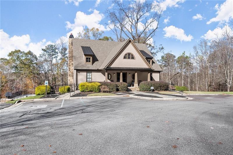 6415 Tranquillity Manor Road Dawsonville, GA 30534 - Photo 2 of 25 a front view of a house with a yard and garage