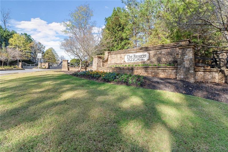 6415 Tranquillity Manor Road Dawsonville, GA 30534 - Photo 22 of 25 a view of a yard with plants and trees