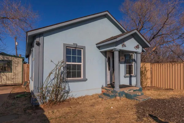 a backyard of a house with seating space