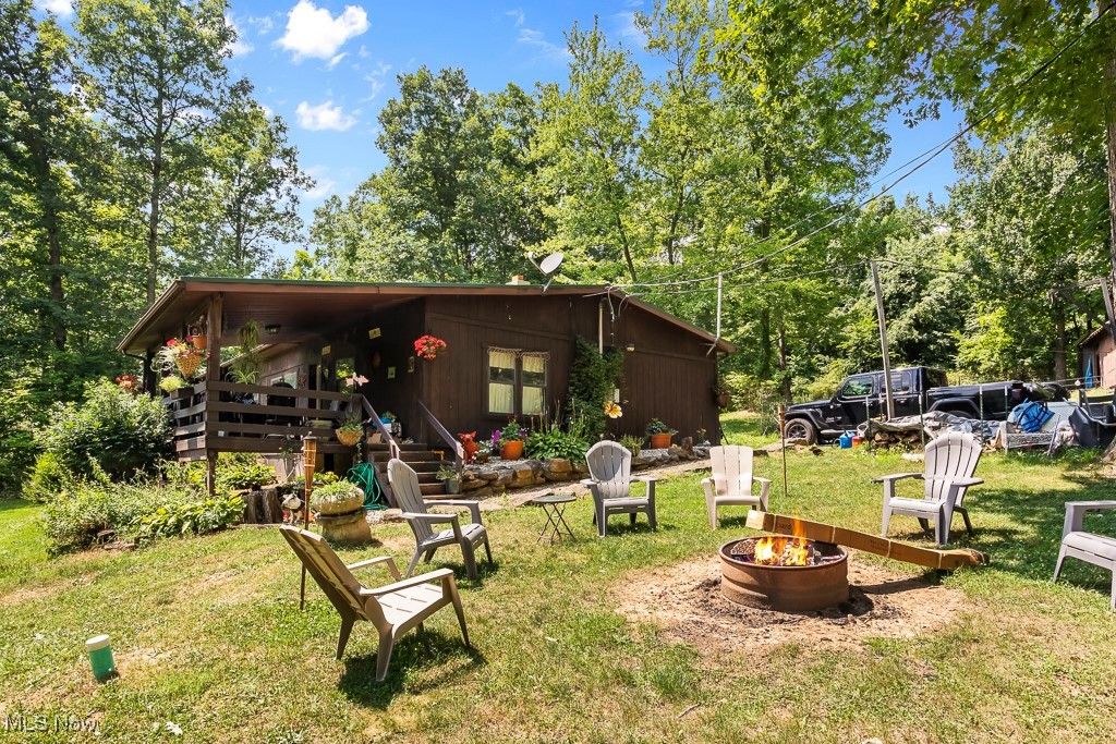 3271 Gorge Road Southwest Dellroy, OH 44620 - Photo 2 of 48 View of yard featuring a fire pit