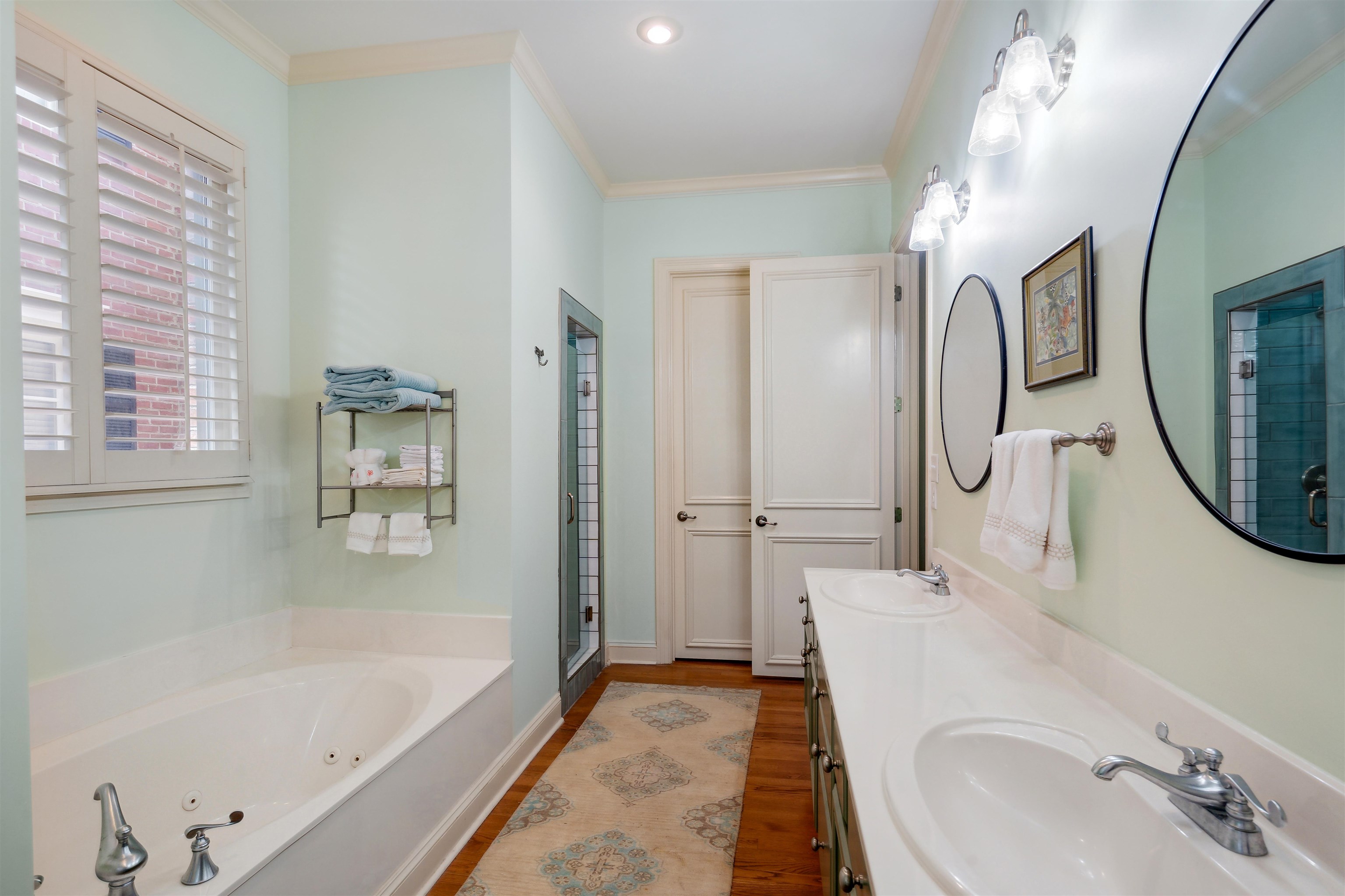 3536 Walnut Grove Road Memphis, TN 38111 - Photo 11 of 18 a bathroom with a tub sink and mirror