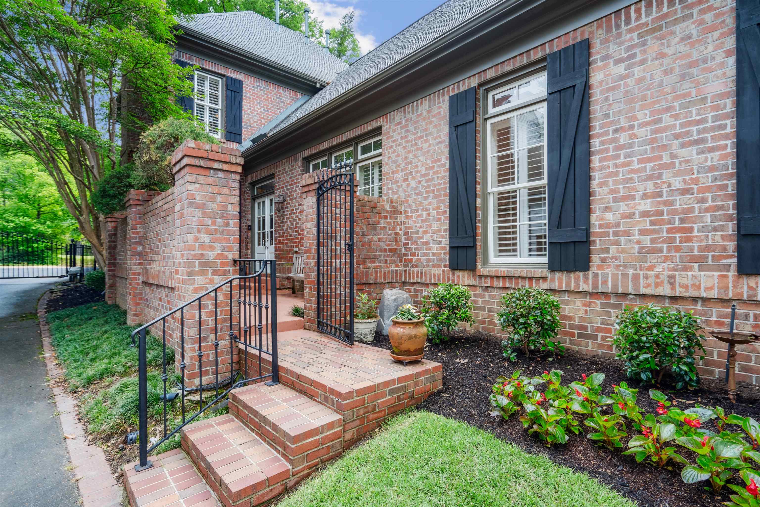 3536 Walnut Grove Road Memphis, TN 38111 - Photo 17 of 18 a front view of a house with a garden