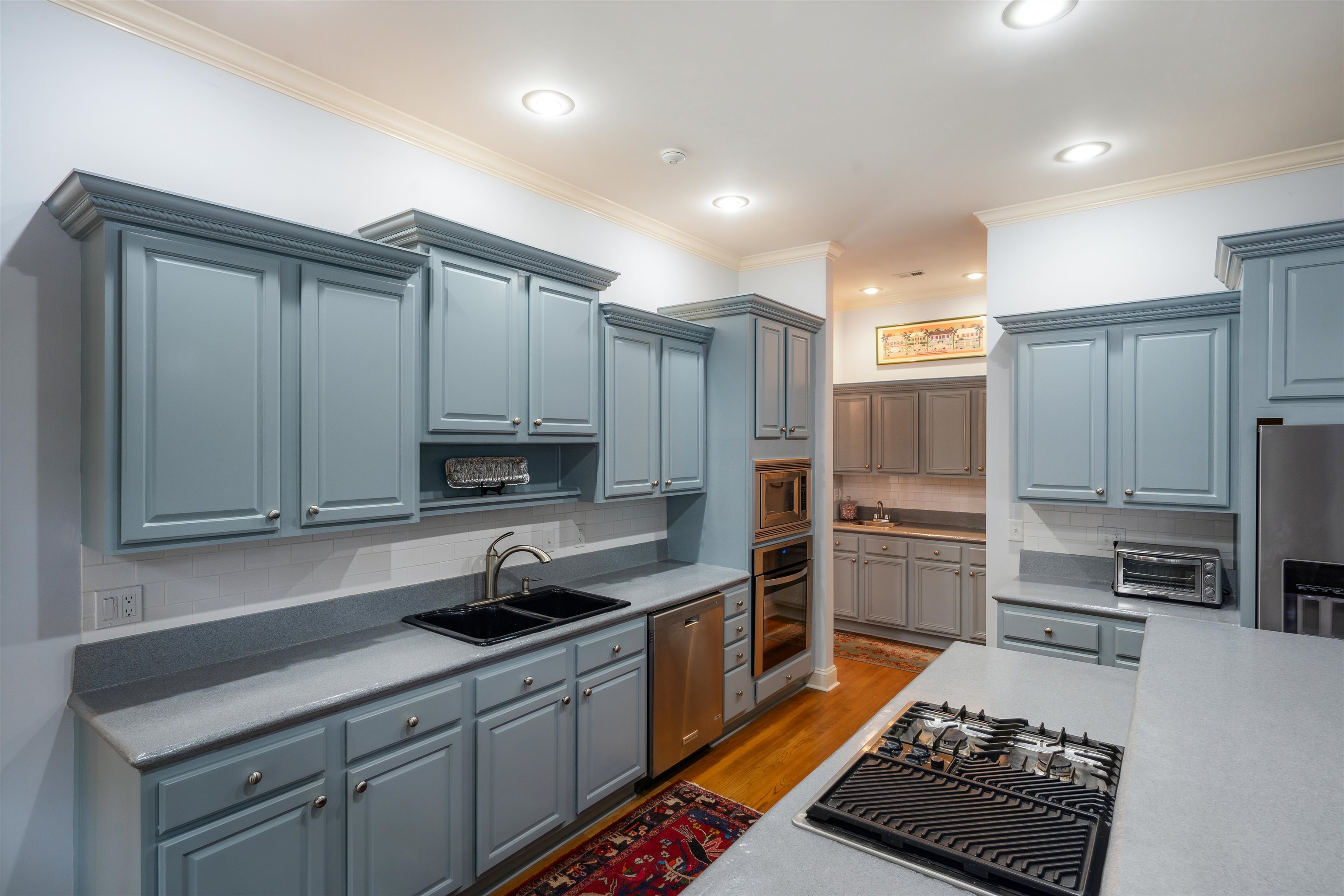 3536 Walnut Grove Road Memphis, TN 38111 - Photo 5 of 18 a kitchen with kitchen island granite countertop a sink stainless steel appliances and cabinets