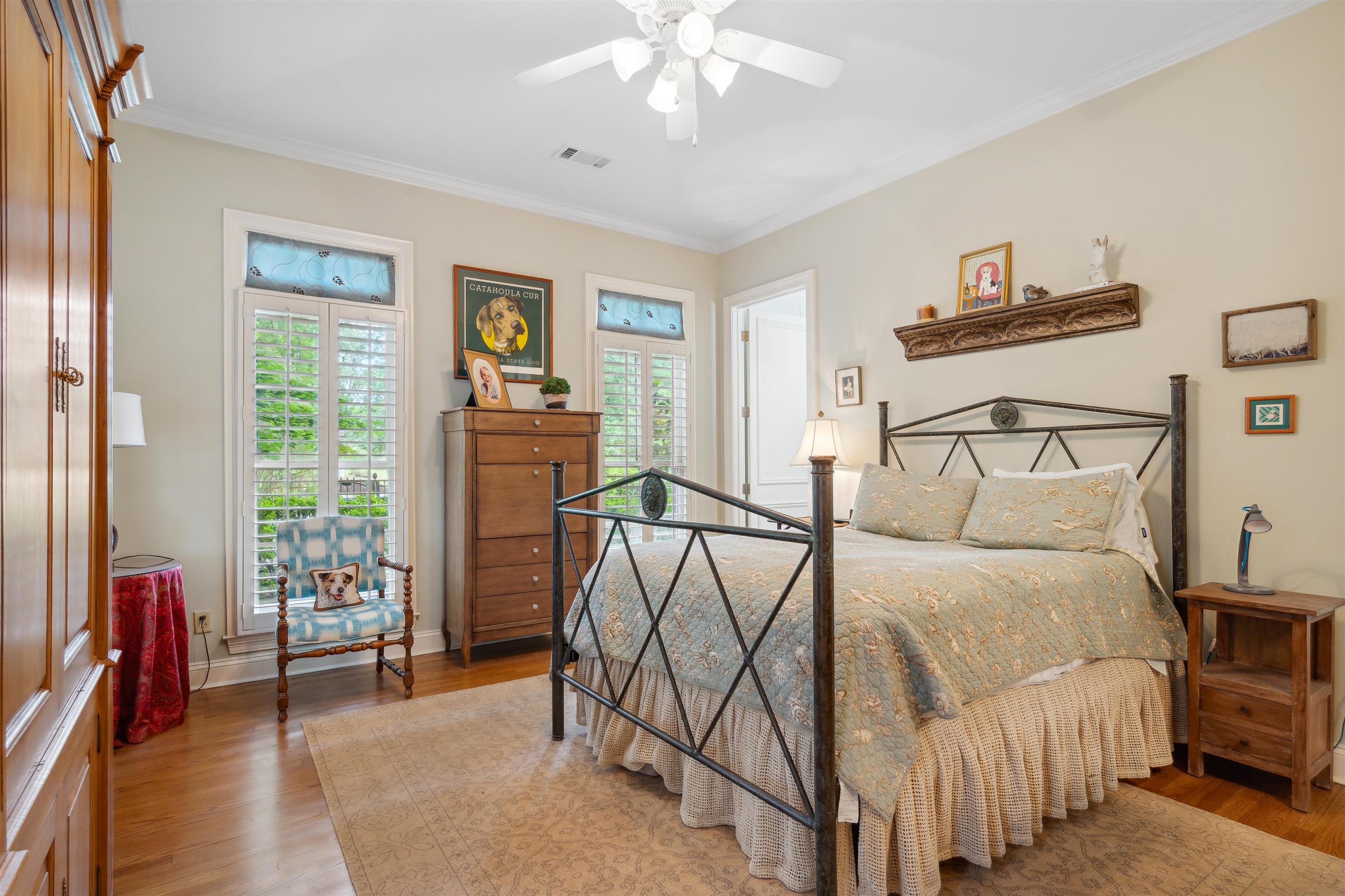 3536 Walnut Grove Road Memphis, TN 38111 - Photo 10 of 18 a bedroom with a bed and a chandelier
