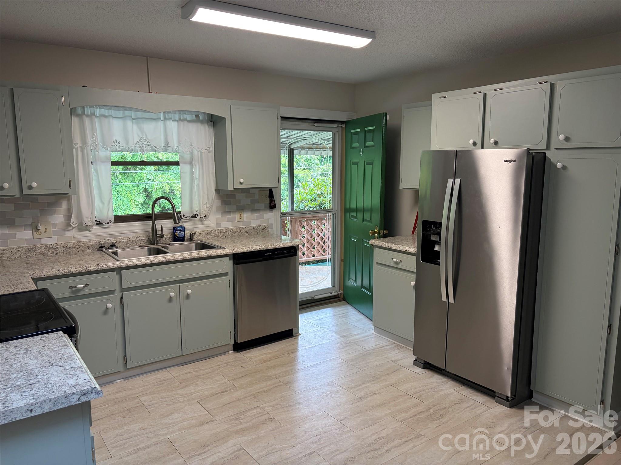 256 A Bruce Road Mars Hill, NC 28754 - Photo 6 of 39 a kitchen with stainless steel appliances granite countertop a refrigerator sink and window