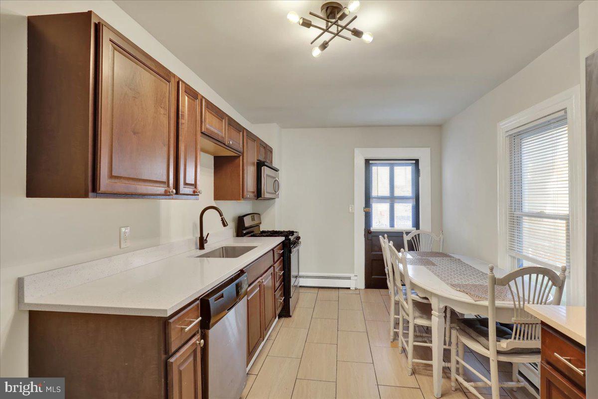 623 Bay Street Lancaster, PA 17603 - Photo 7 of 23 a kitchen with a sink cabinets and window