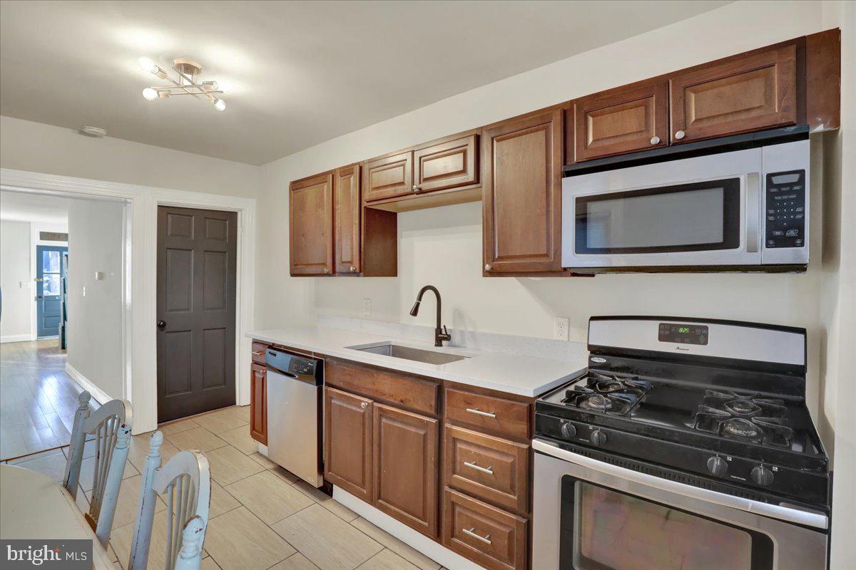 623 Bay Street Lancaster, PA 17603 - Photo 8 of 23 a kitchen with stainless steel appliances granite countertop a stove and a microwave