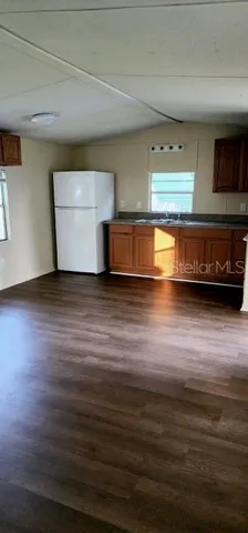 a view of a livingroom with wooden floor
