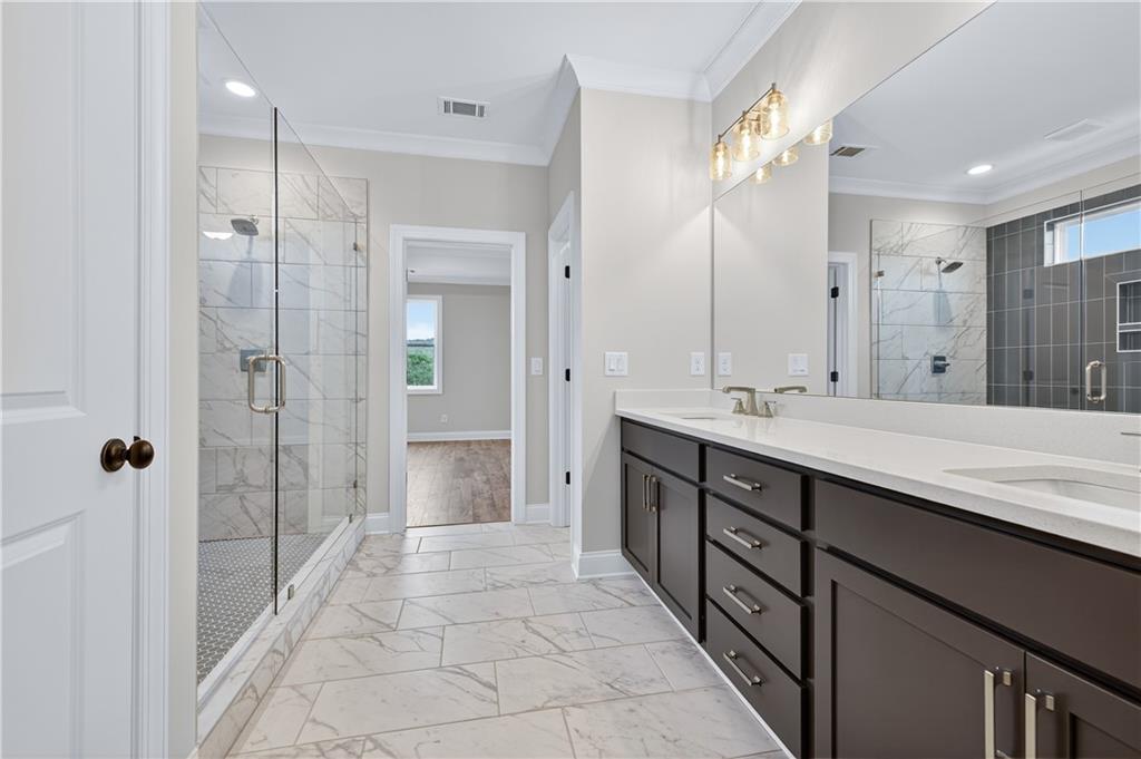 3787 Cheyenne Lane Jefferson, GA 30549 - Photo 45 of 82 a bathroom with a double vanity sink shower and a mirror