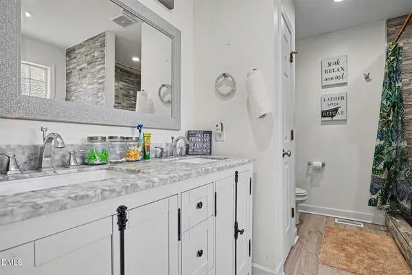 a view of a livingroom with furniture and a flat screen tv