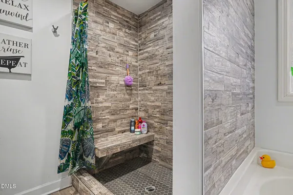 a house view with swimming pool in front of it