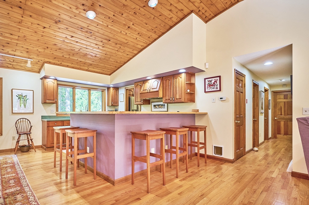 72 Crooked Ledge Road Southampton, MA 01073 - Photo 11 of 42 a dining hall with stainless steel appliances granite countertop a stove and chairs with wooden floor