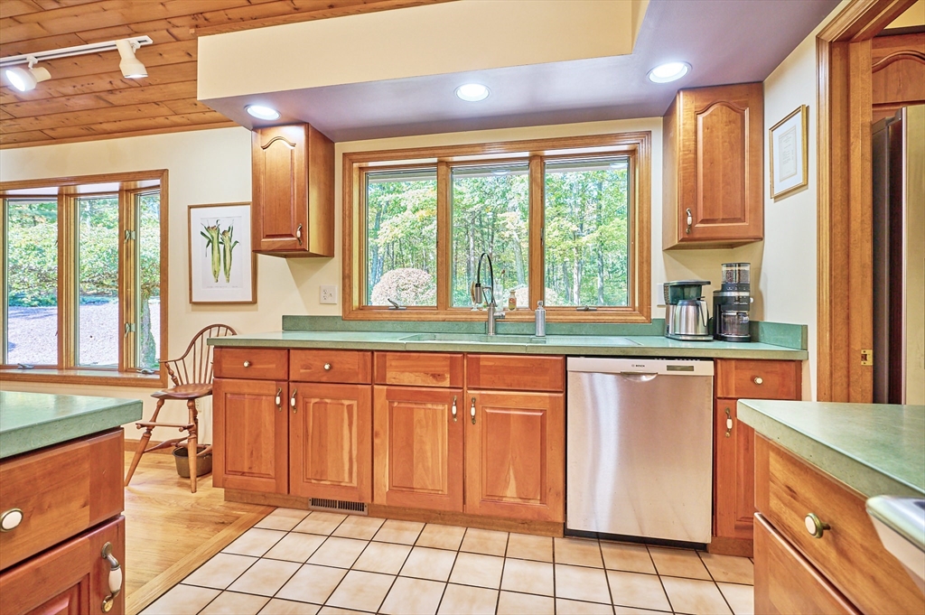 72 Crooked Ledge Road Southampton, MA 01073 - Photo 13 of 42 a kitchen with stainless steel appliances a sink and a large window