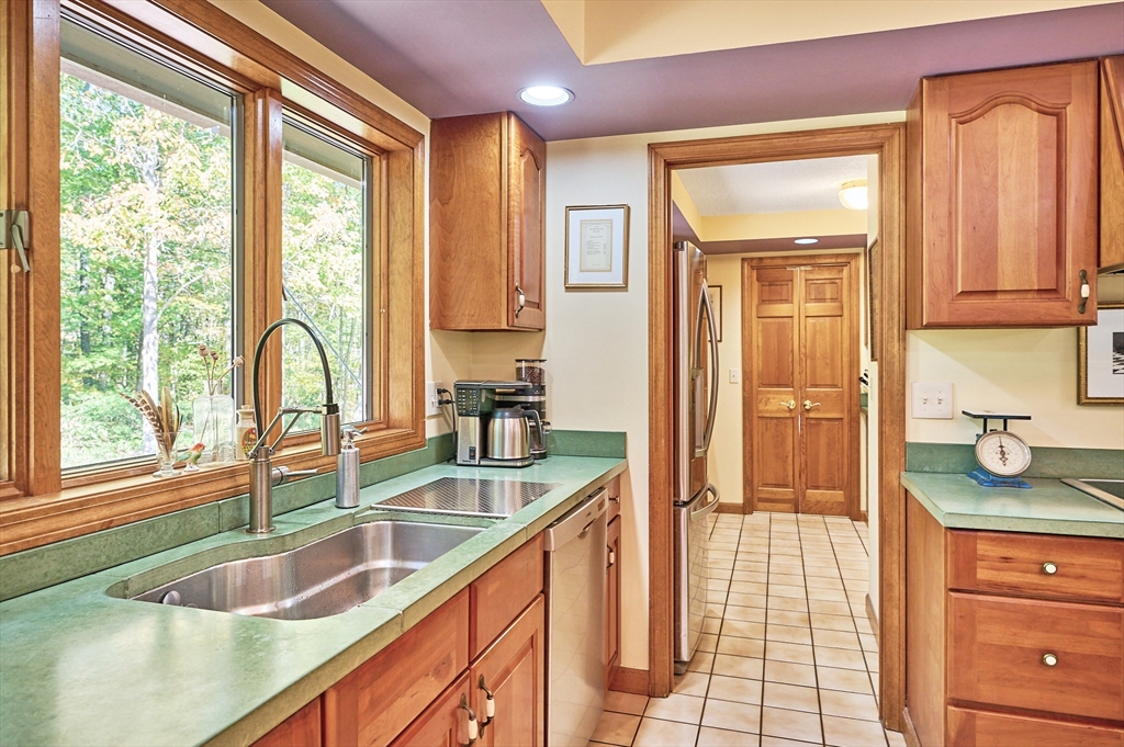 72 Crooked Ledge Road Southampton, MA 01073 - Photo 15 of 42 a kitchen with granite countertop a sink and a window