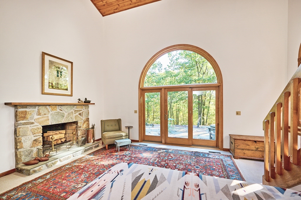 72 Crooked Ledge Road Southampton, MA 01073 - Photo 20 of 42 a bedroom with a bed and a fireplace