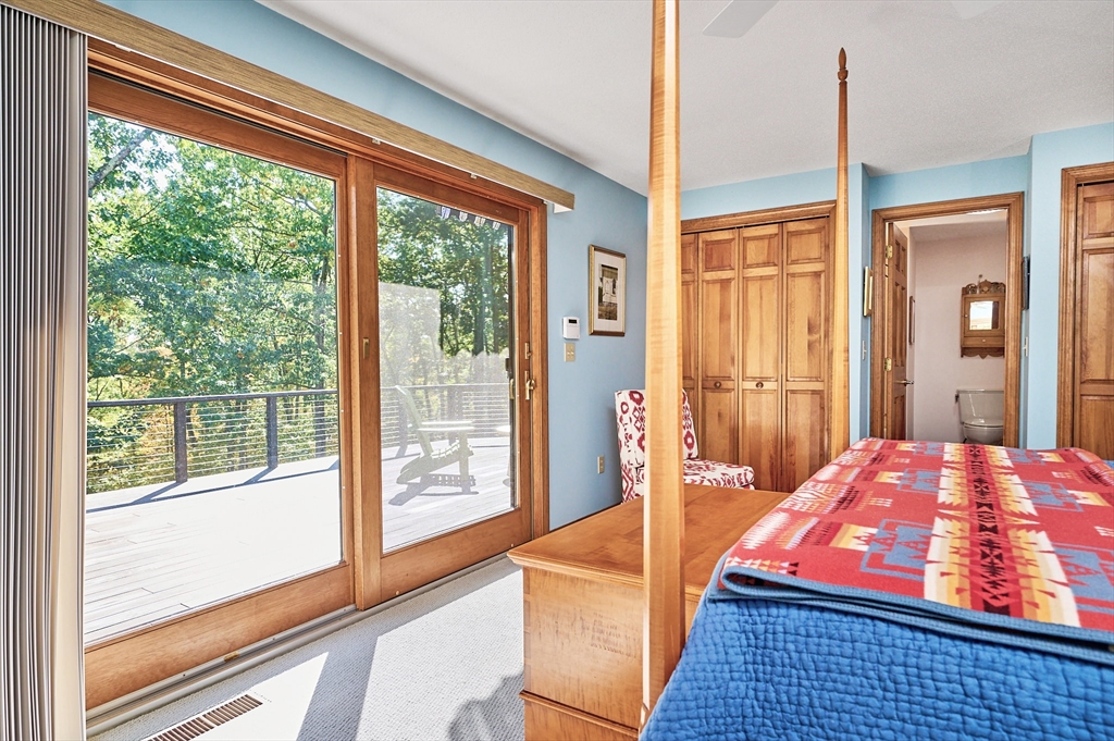 72 Crooked Ledge Road Southampton, MA 01073 - Photo 23 of 42 a bedroom with large window and a bed