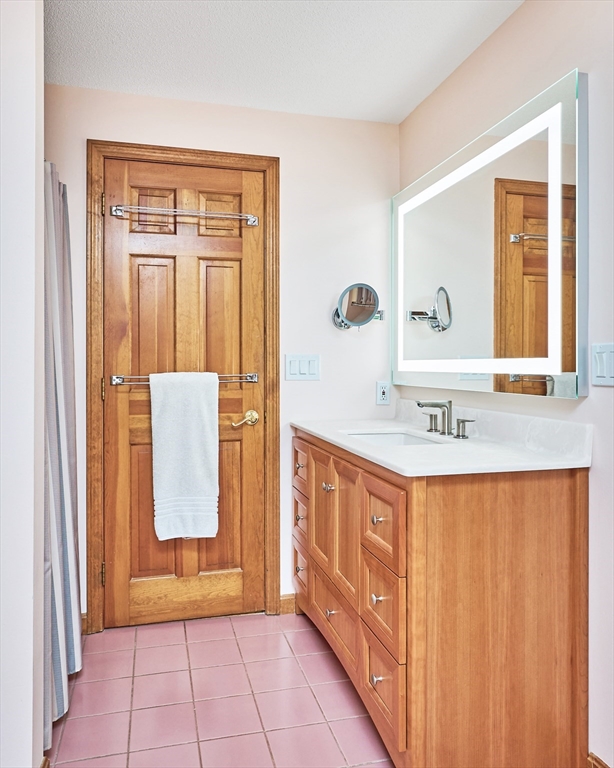 72 Crooked Ledge Road Southampton, MA 01073 - Photo 24 of 42 a bathroom with a sink a mirror and a bathtub