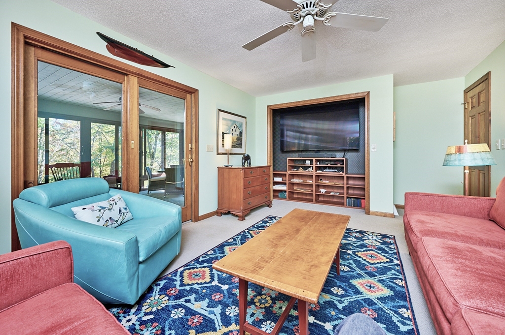 72 Crooked Ledge Road Southampton, MA 01073 - Photo 26 of 42 a living room with furniture and a flat screen tv
