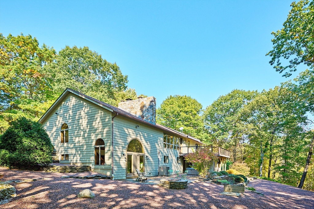 72 Crooked Ledge Road Southampton, MA 01073 - Photo 30 of 42 a view of a big house with large trees and plants