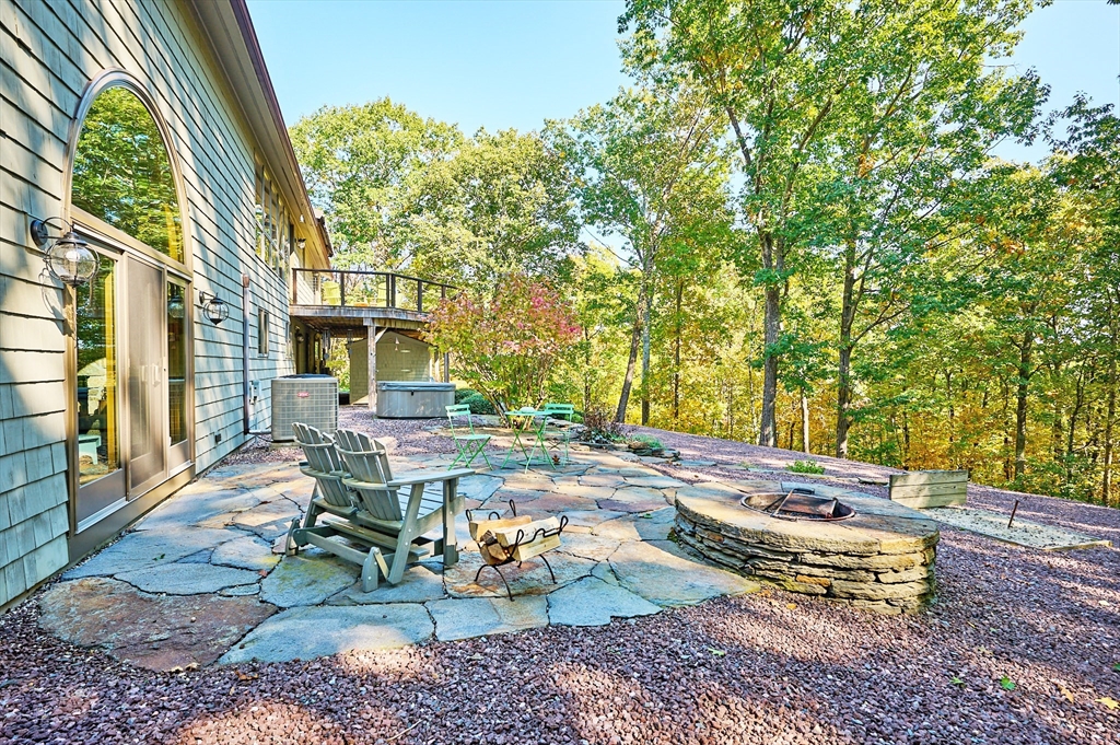 72 Crooked Ledge Road Southampton, MA 01073 - Photo 31 of 42 a view of a patio with table and chairs and potted plants