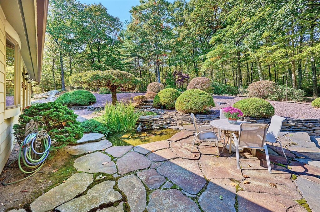 72 Crooked Ledge Road Southampton, MA 01073 - Photo 34 of 42 a view of a chairs and table in backyard