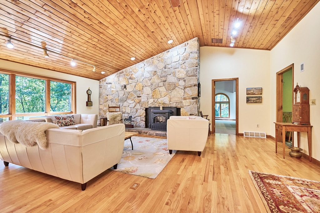 72 Crooked Ledge Road Southampton, MA 01073 - Photo 4 of 42 a living room with fireplace furniture and a wooden floor