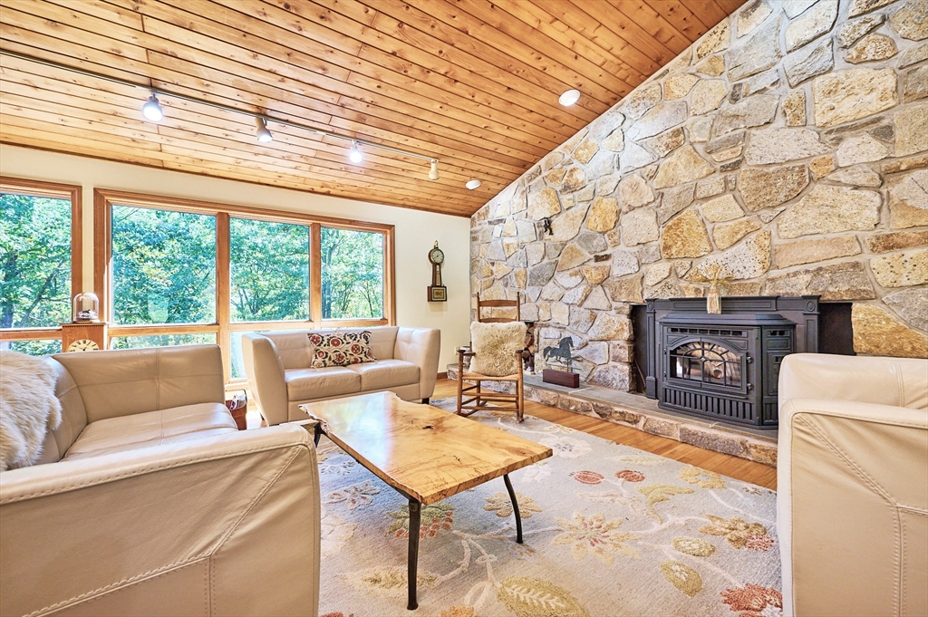 72 Crooked Ledge Road Southampton, MA 01073 - Photo 6 of 42 a living room with fireplace furniture and a floor to ceiling window