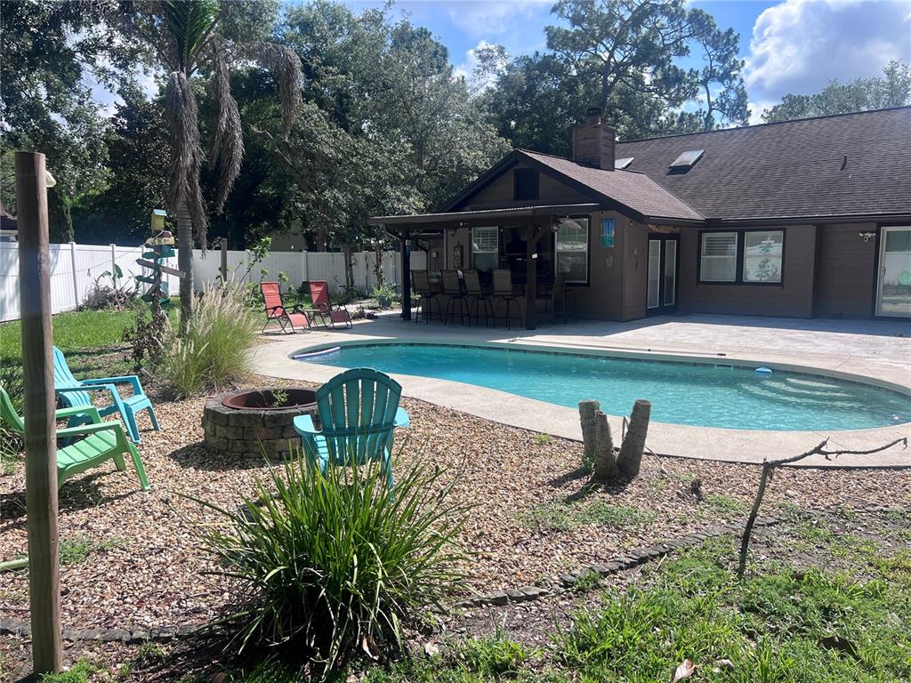357 Tymber Run Ormond Beach, FL 32174 - Photo 30 of 32 a front view of a house with garden