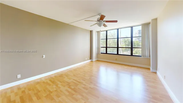 a view of an empty room with a window